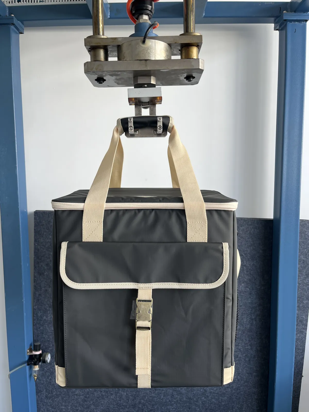 TrailCooler Pro cooler bag carry straps undergoing load testing in a lab rig